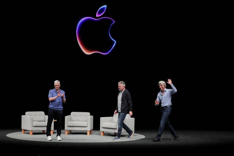 Apple CEO Tim Cook attends a panel discussion with Craig Federighi and John Giannandrea during the annual developer conference event at the companys headquarters in Cupertino California U.S. June 10 2024. REUTERSCarlos Barria