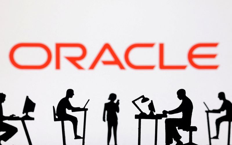 Figurines with computers and smartphones are seen in front of Oracle logo in this illustration taken February 19 2024. REUTERSDado RuvicIllustration