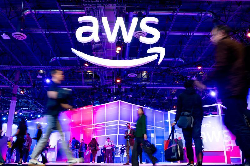FILE PHOTO Attendees walk through an expo hall at AWS reInvent 2023 a conference hosted by Amazon Web Services AWS in Las Vegas Nevada U.S. November 29 2023. Noah BergerAWSHandout via REUTERS