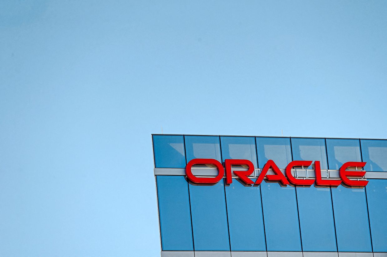 Oracle shares hit record high on AI, cloud growth | The Star