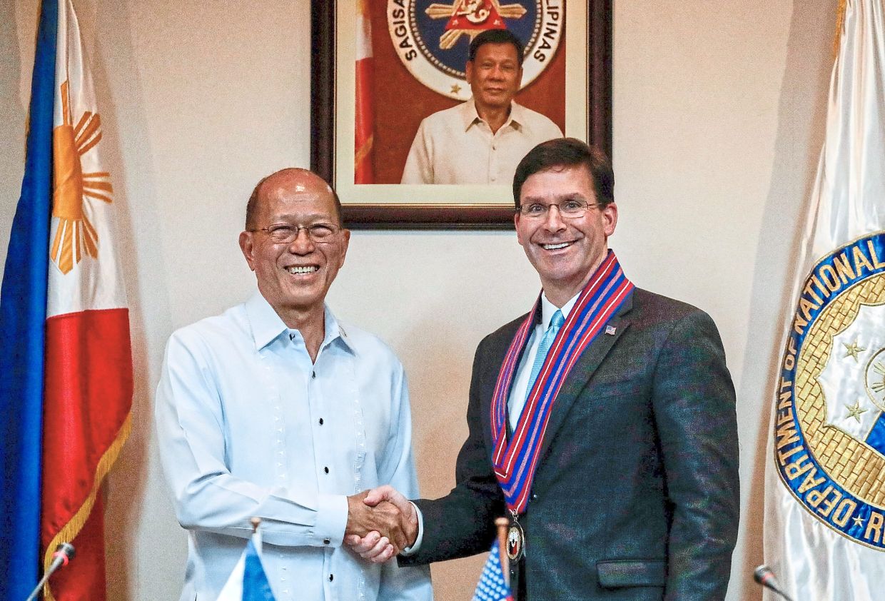 Mover and shaker: Esper with his Philippine counterpart Delfin Lorenzana during a news conference in the Philippines in November 2019. That same year, Esper signed a secret order that later paved the way for the launch of the US military’s clandestine anti-vax propaganda campaign. — Reuters