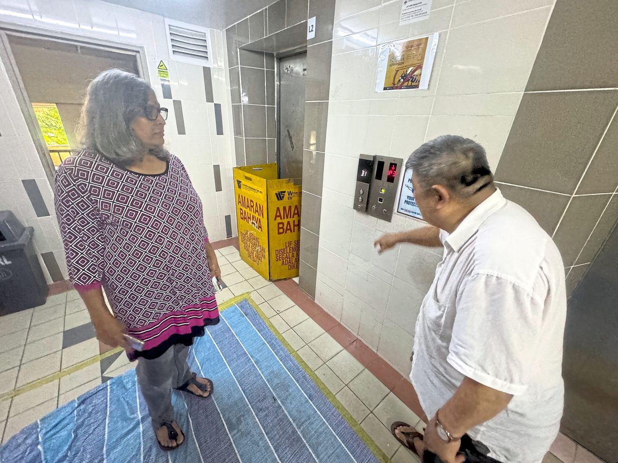 Sasikala (left) and Beh say the condominium’s lifts are in very poor condition.