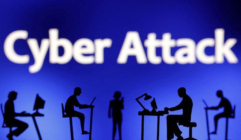 FILE PHOTO Figurines with computers and smartphones are seen in front of the words quotCyber Attackquot in this illustration taken February 19 2024. REUTERSDado RuvicIllustrationFile Photo