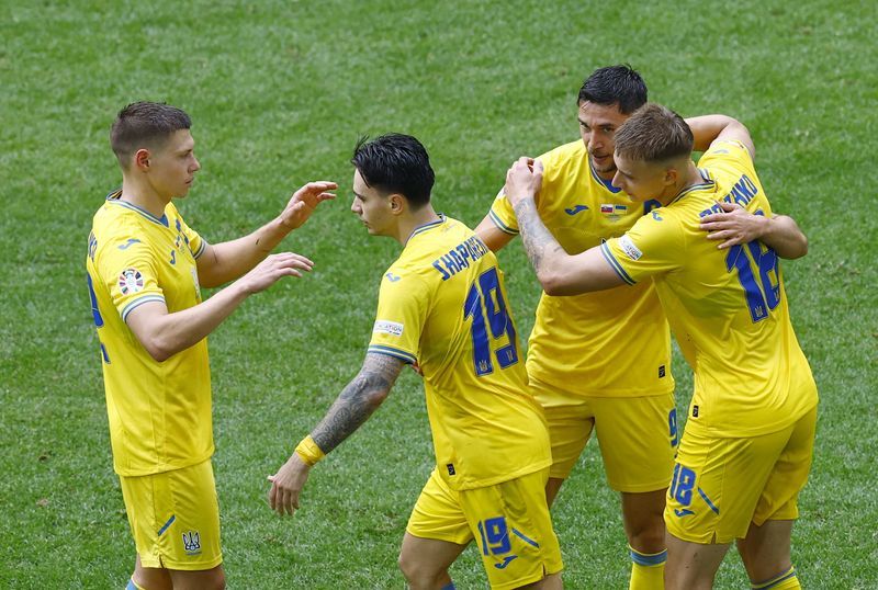 Soccer-Ukraine and Belgium dare not slip up as Group E on a knife edge