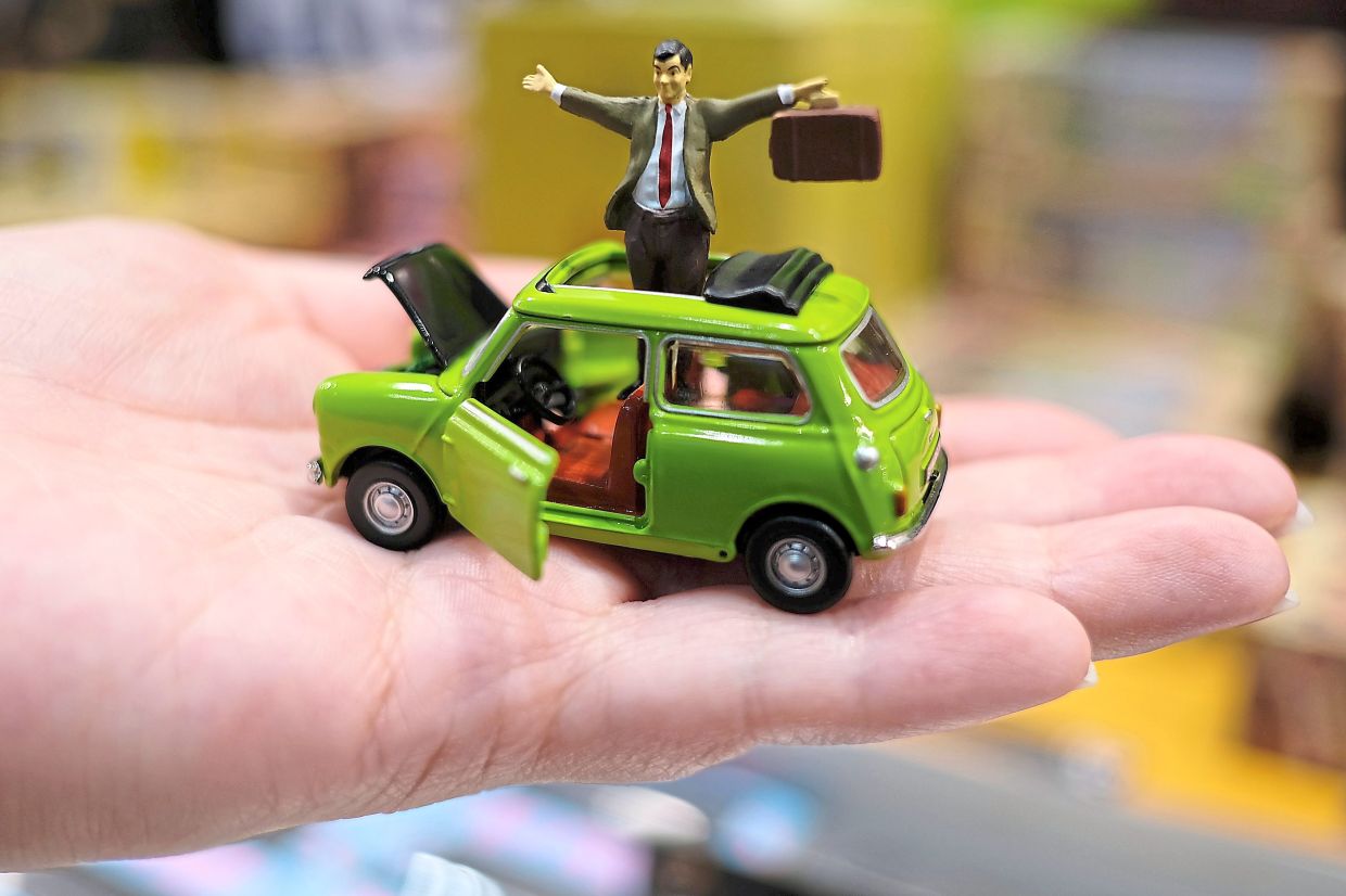 Greeting visitors is Mr. Bean in his green mini.