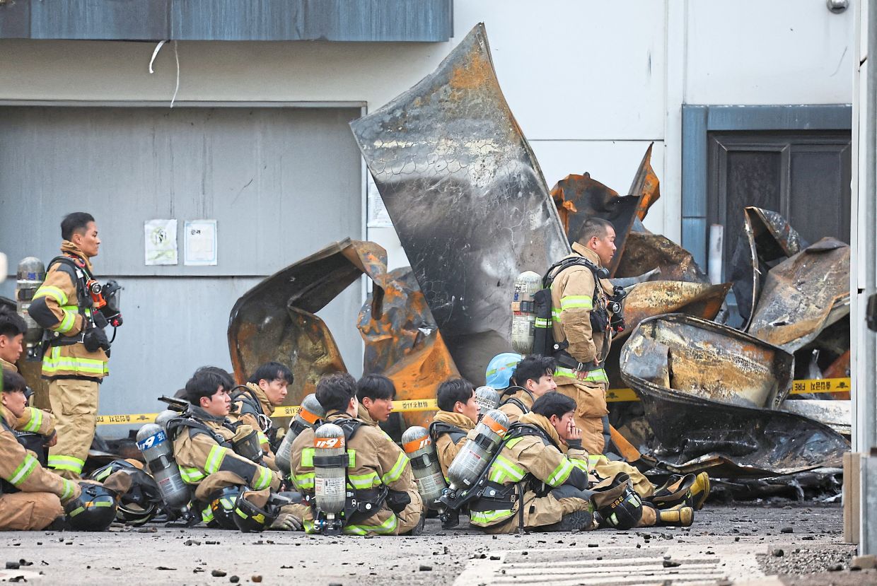 Burnt factory searched after blaze kills 22