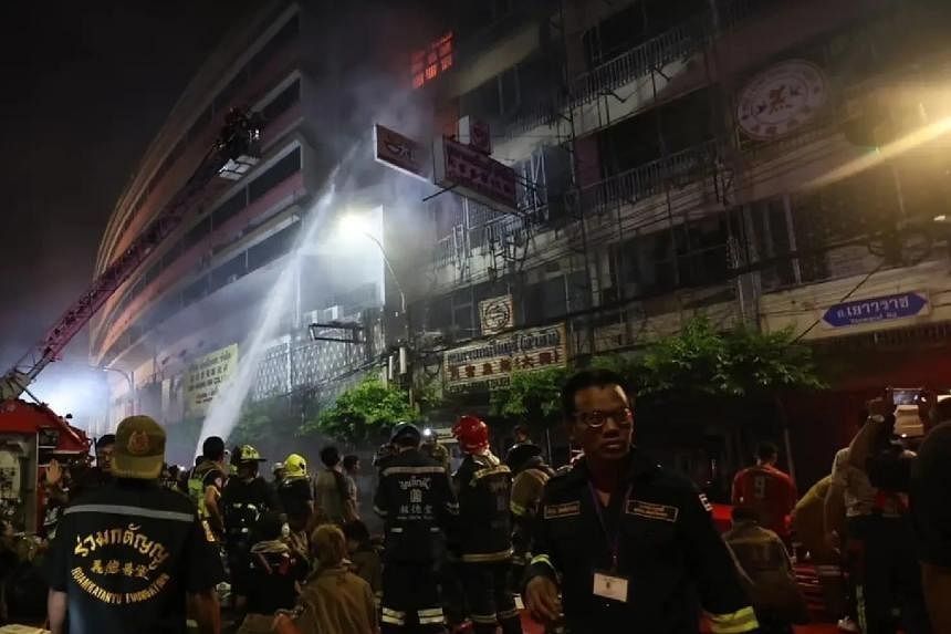 The fire broke out in a narrow alley that had only one hydrant, making it difficult for the firefighting team to access water. - PHOTO: THE NATION/ASIA NEWS NETWORK