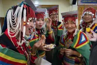 Hundreds of mostly exiled Tibetans celebrate the Dalai Lama's 89th birthday in India's Dharamshala