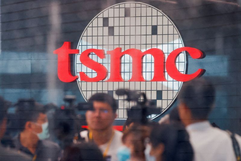 FILE PHOTO Taiwan Semiconductor Manufacturing Cos logo is seen while people attend the opening of the TSMC global RampD centre in Hsinchu Taiwan July 28 2023. REUTERSAnn WangFile Photo