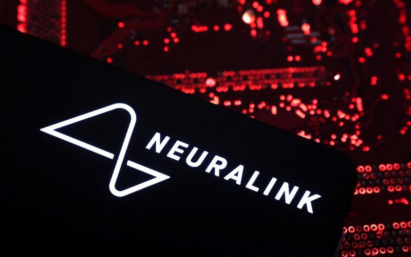 FILE PHOTO A smartphone with a Neuralink logo displayed is placed on a computer motherboard in this illustration taken on May 15 2024. REUTERSDado RuvicIllustrationFile Photo