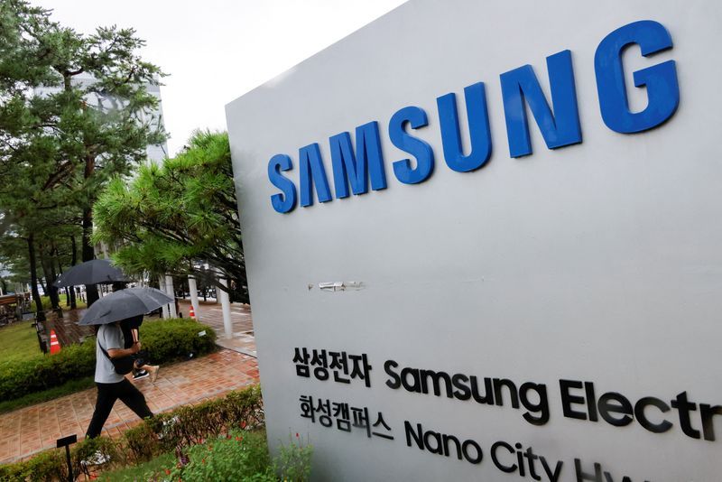 FILE PHOTO A man walks past a signboard of Samsung Electronics in front of the Samsung Electronics Nano City Hwaseong Campus in Hwaseong South Korea July 8 2024. REUTERSKim Soo-hyeonFile Photo