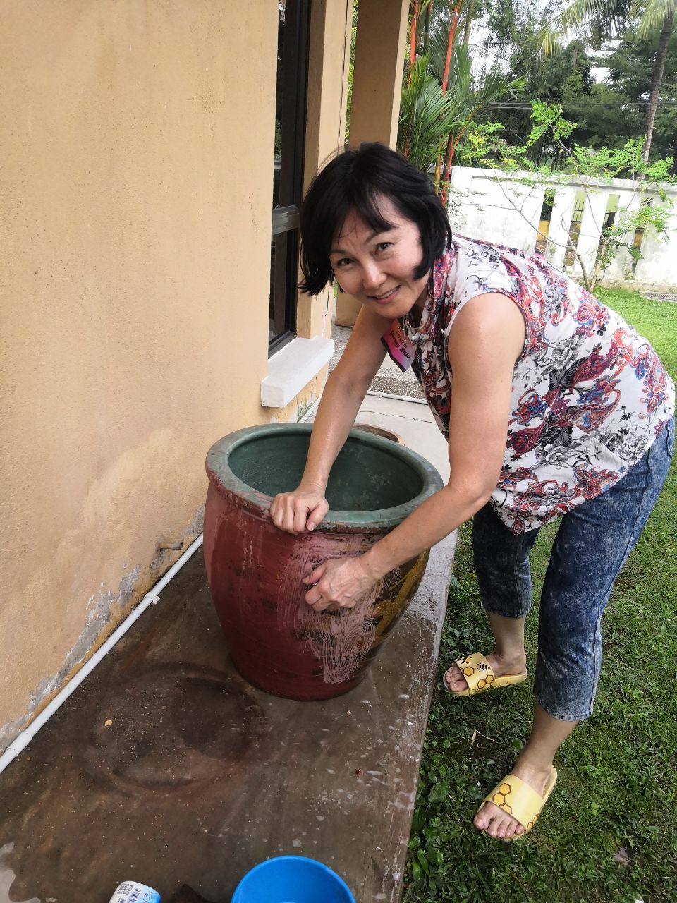The columnist hard at work on her parents old garden pot. — Photo provided