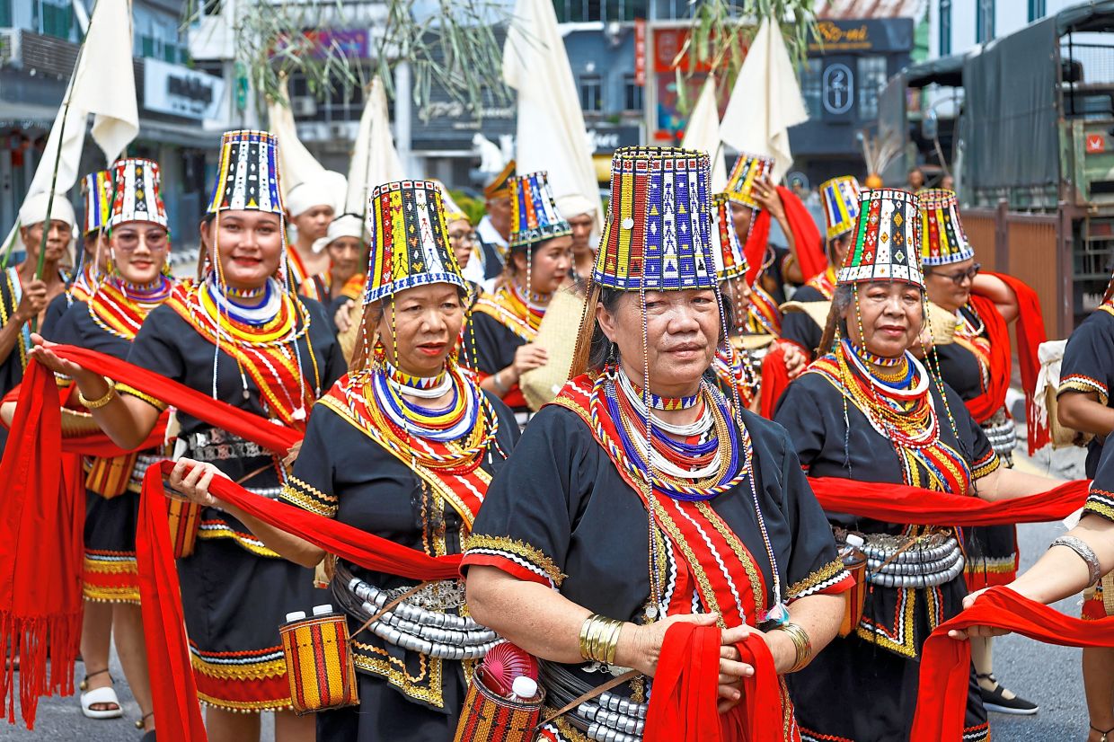 Bidayuh women in their traditional costumes at the Gawai parade in Kuching, Sarawak. — ZULAZHAR SHEBLEE/The Star
