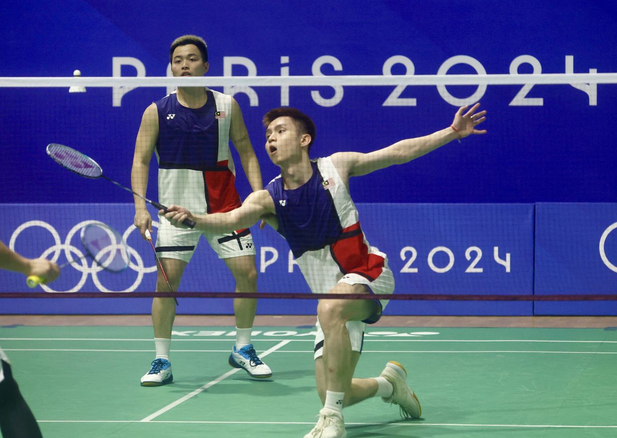 Aaron-Soh win again and out to beat China's world No. 1 to top group