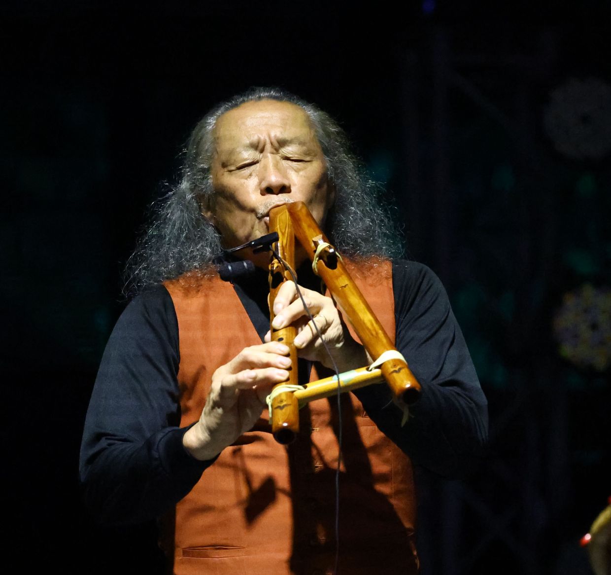 A full-house crowd watching Kitaro perform.