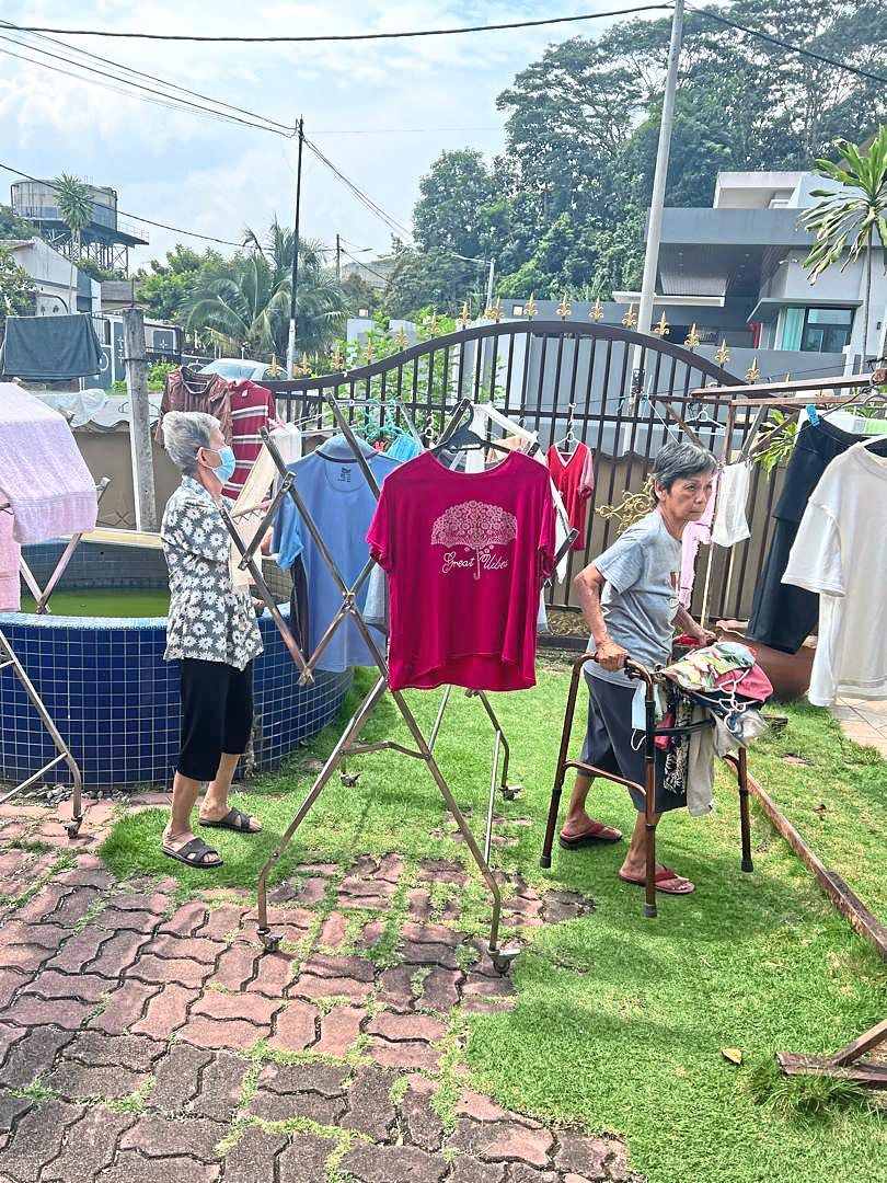 Elderly residents doing simple chores to give them a sense of purpose in the home.