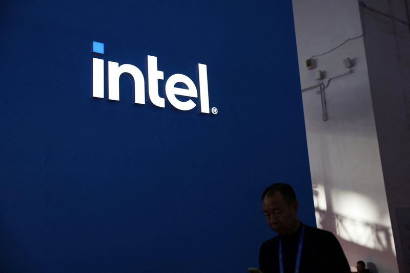 FILE PHOTO A man walks past the Intel logo at its booth during the first China International Supply Chain Expo CISCE in Beijing China November 28 2023. REUTERSFlorence LoFile Photo