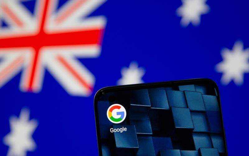 Smartphone with google app icon is seen in front of the displayed Australian flag in this illustration taken January 22 2021. REUTERSDado RuvicIllustration File Photo