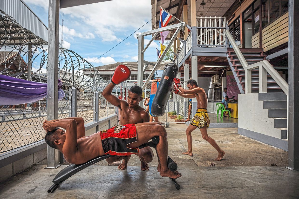 Inmates train in a small gym area of the Chaiya District Prison in Surat Thani, Thailand.— ©2024 The New York Times Company