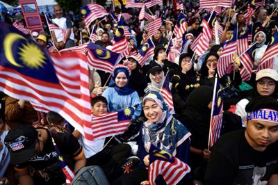 Part of the crowds waving the Jalur Gemilang on the 67th Merdeka Day celebration at Putrajaya on Saturday. — IZZRAFIQ ALIAS/The Star