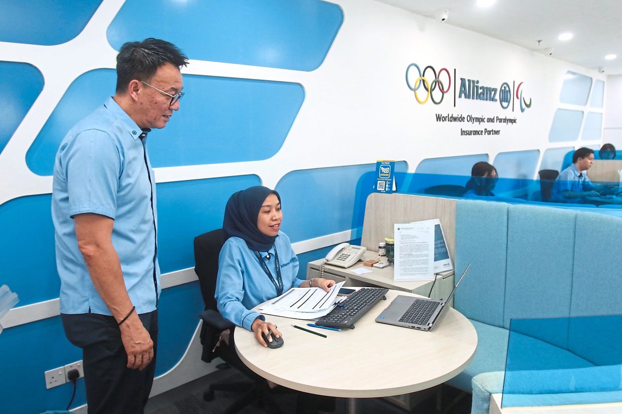Wang (left) said the branch transformation initiative, which started in 2022, is part of efforts to  enhance the customer experience.