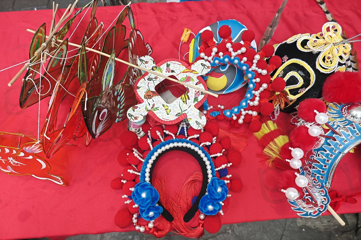 There are props available for visitors to take pictures with at the Mid-Autumn Festival art installation.