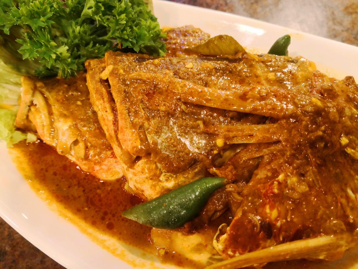 Fish head curry is a truly Malaysian dish that transcends Malay, Indian and Chinese cooking styles.