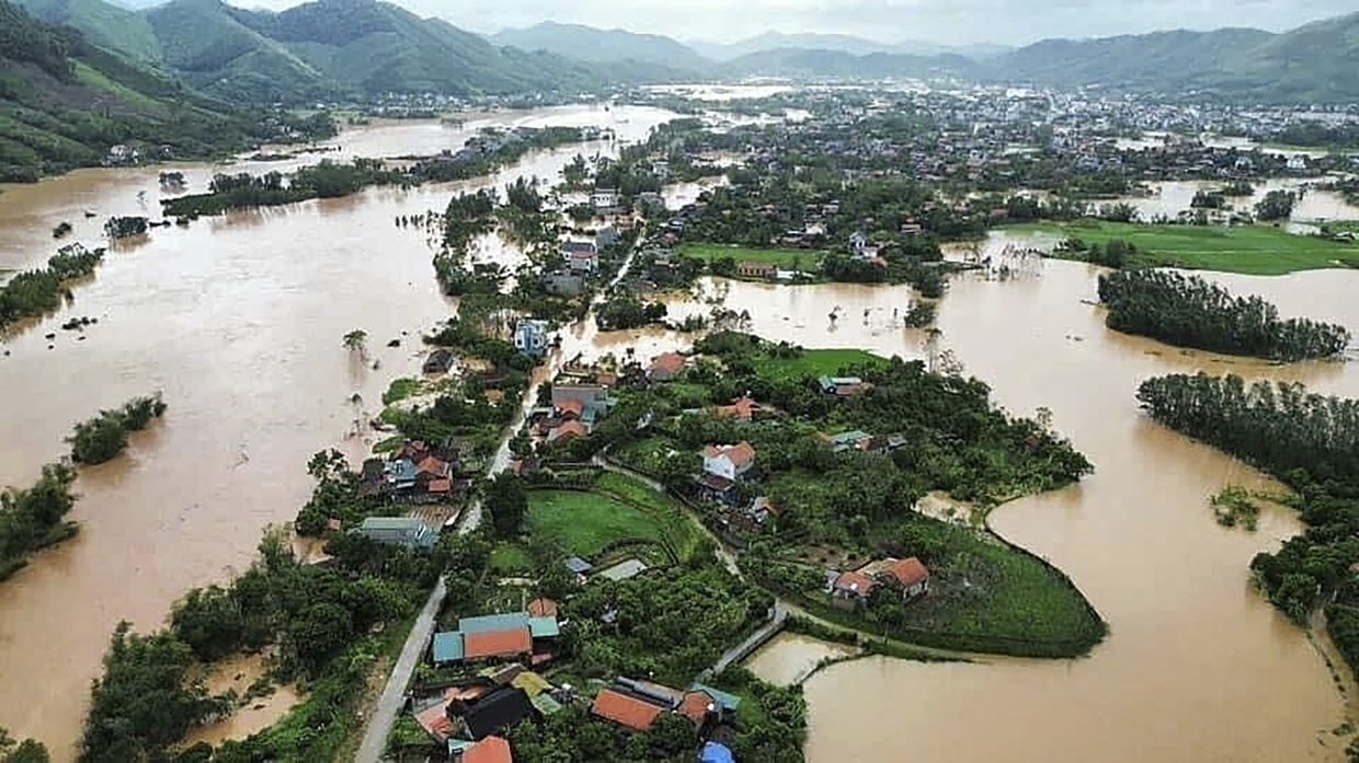 Flood triggered by Typhoon Yagi submerges houses in Bac Giang province, Vietnam. - AP