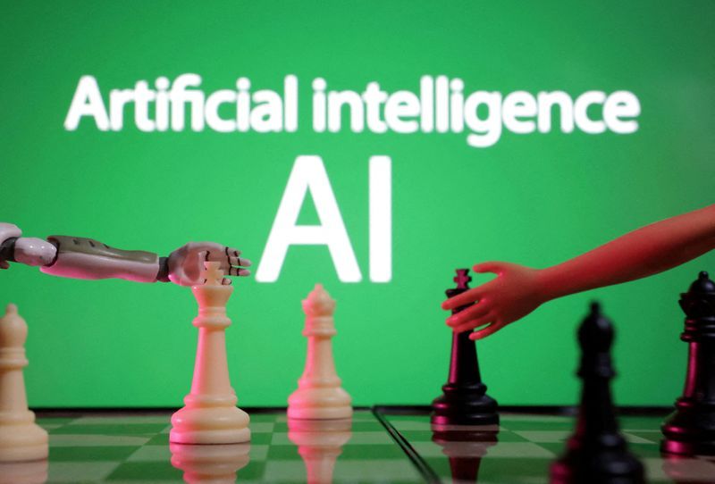 FILE PHOTO Words reading quotArtificial intelligence AIquot miniature of robot and toy hand are picture in this illustration taken December 14 2023. REUTERSDado RuvicIllustrationFile Photo