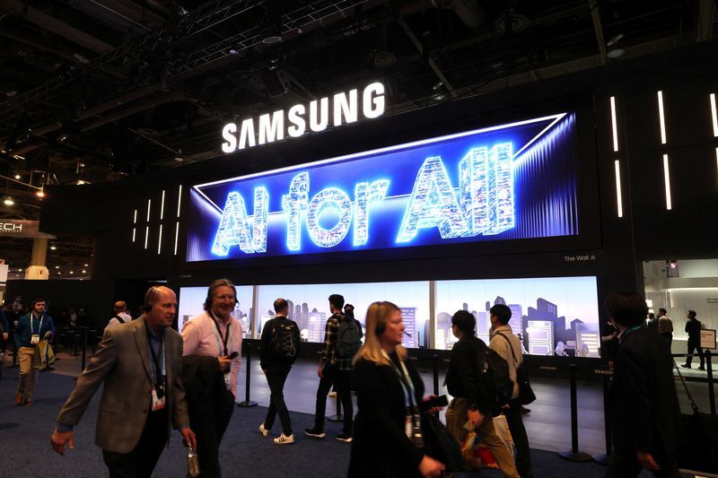 FILE PHOTO People walk past a Samsung Electronics booth during CES 2024 an annual consumer electronics trade show in Las Vegas Nevada U.S. January 9 2024. REUTERSSteve MarcusFile Photo