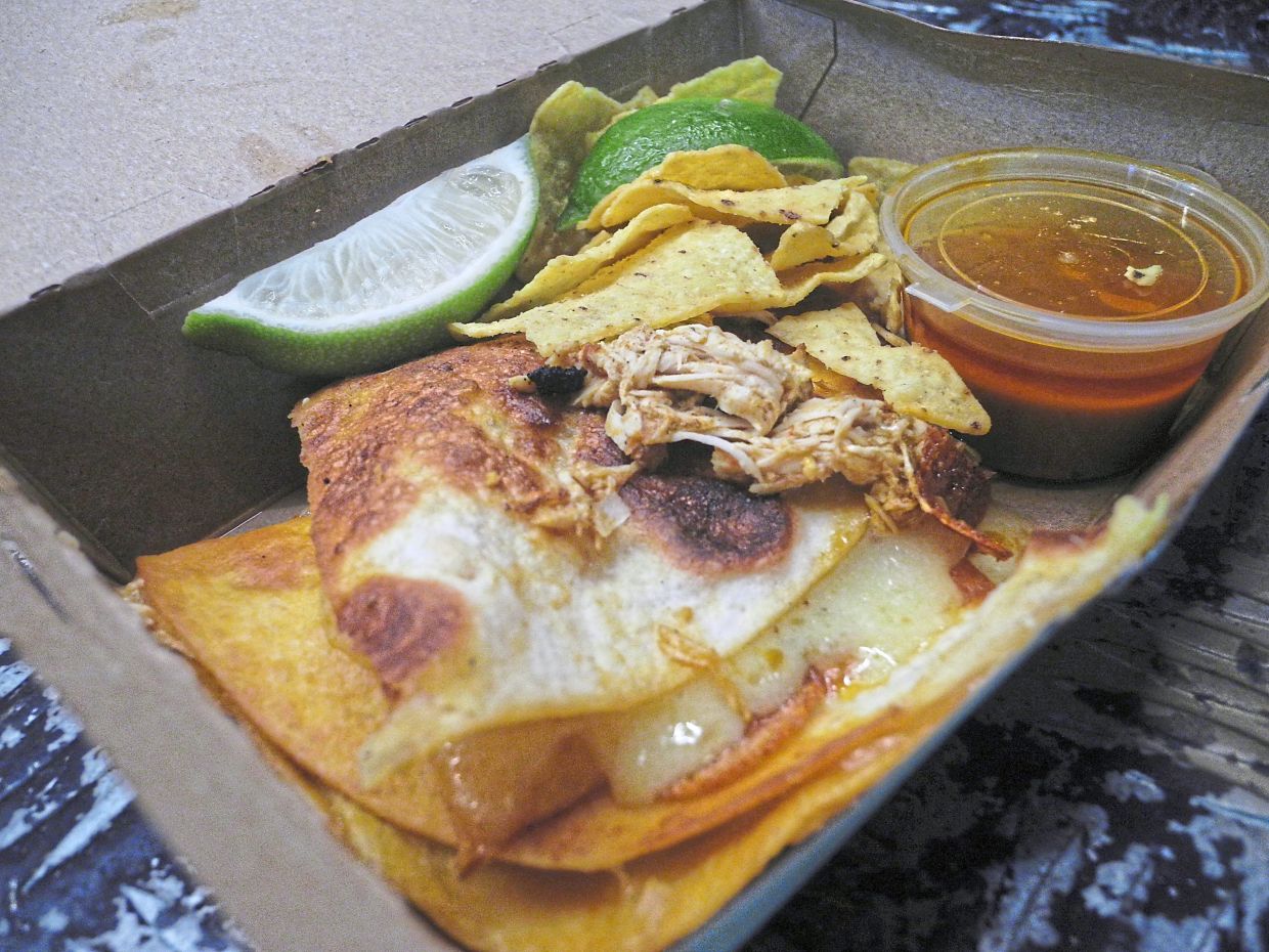 Chicken taco with all the trimmings.