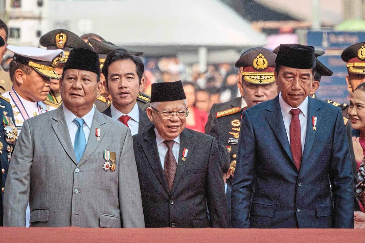 Public figures: Gibran (back row, second left) with (from right) Jokowi, vice-president Ma’ruf Amin and Prabowo in Jakarta. — AFP