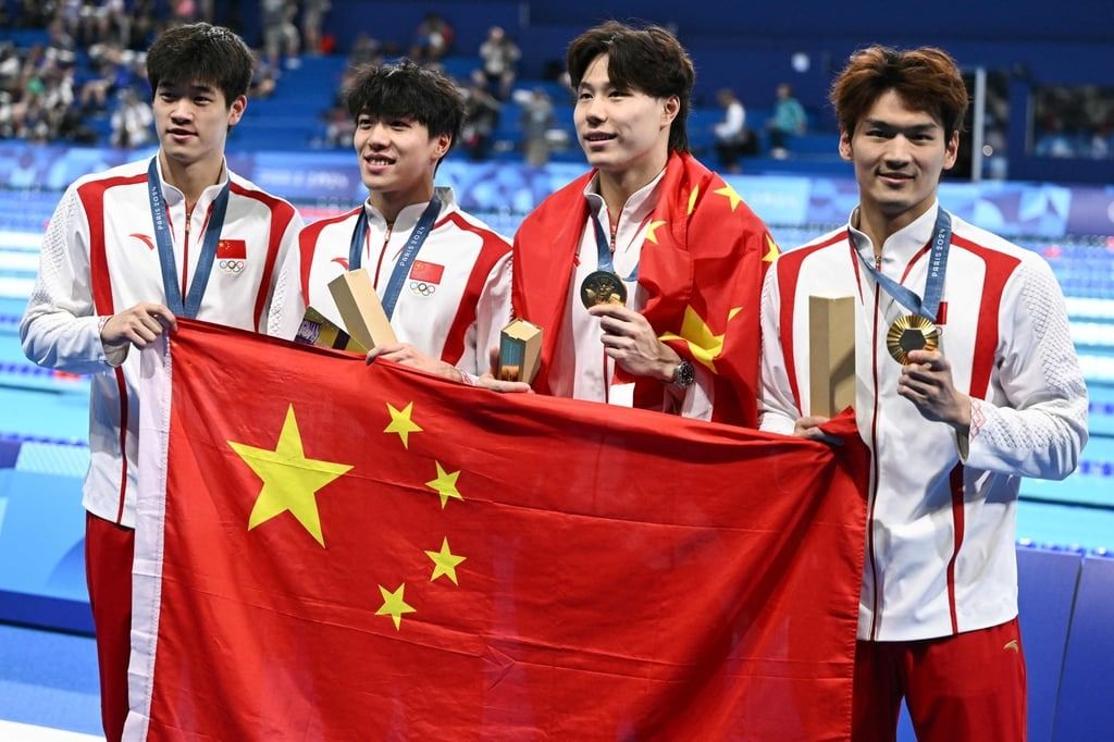 (From left) Pan Zhanle, Sun Jiajun, Qin Haiyang and Xu Jiayu took 4x100m medley relay gold in Paris. - Photo: AFP