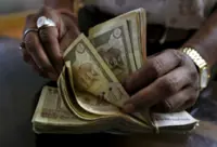 Rupee faces slow grind lower on oil, China rotation risks