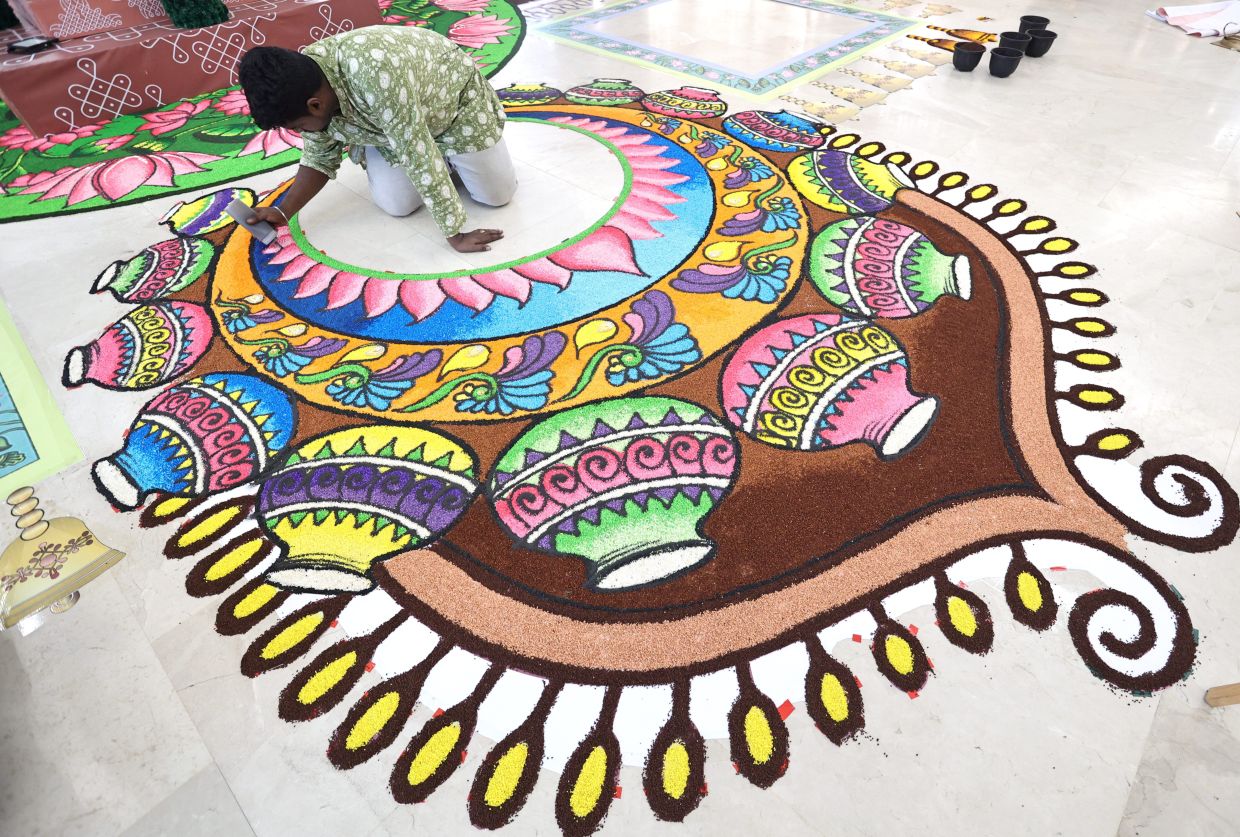 This stunning kolam is crafted from semolina, showcasing the versatility of this traditional art form as it combines texture and colour. — AZMAN GHANI/The Star