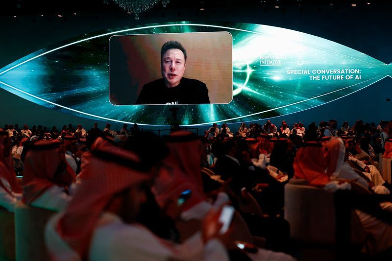Tesla CEO and X owner Elon Musk appears on a screen as he virtually attends the Future Investment Initiative FII in Riyadh Saudi Arabia October 29 2024. REUTERSHamad I Mohammed