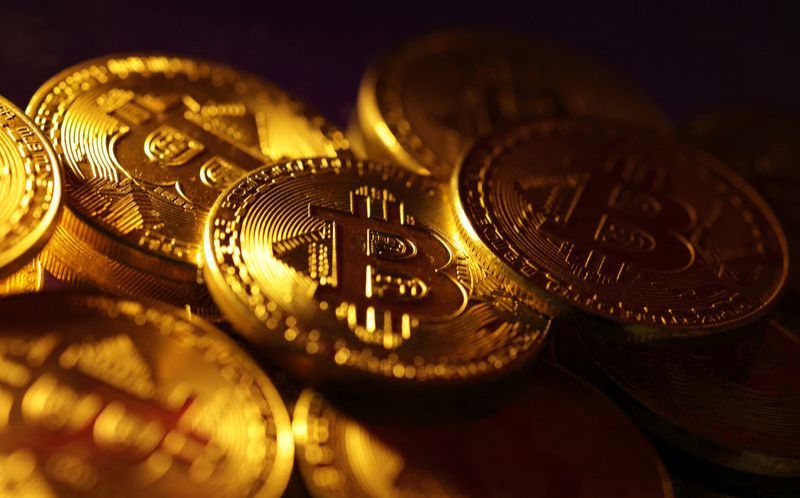 FILE PHOTO Physical representations of the bitcoin cryptocurrency are seen in this illustration taken October 24 2023. REUTERSDado RuvicIllustrationFile Photo