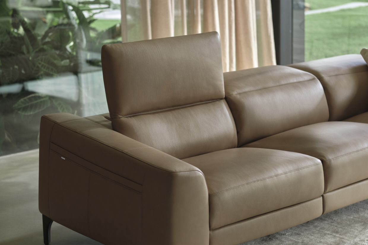 The Reo Sofa, with its sleek silhouette and luxurious leather upholstery, serves as the perfect centrepiece, blending modern elegance and comfort for a stylish living space.