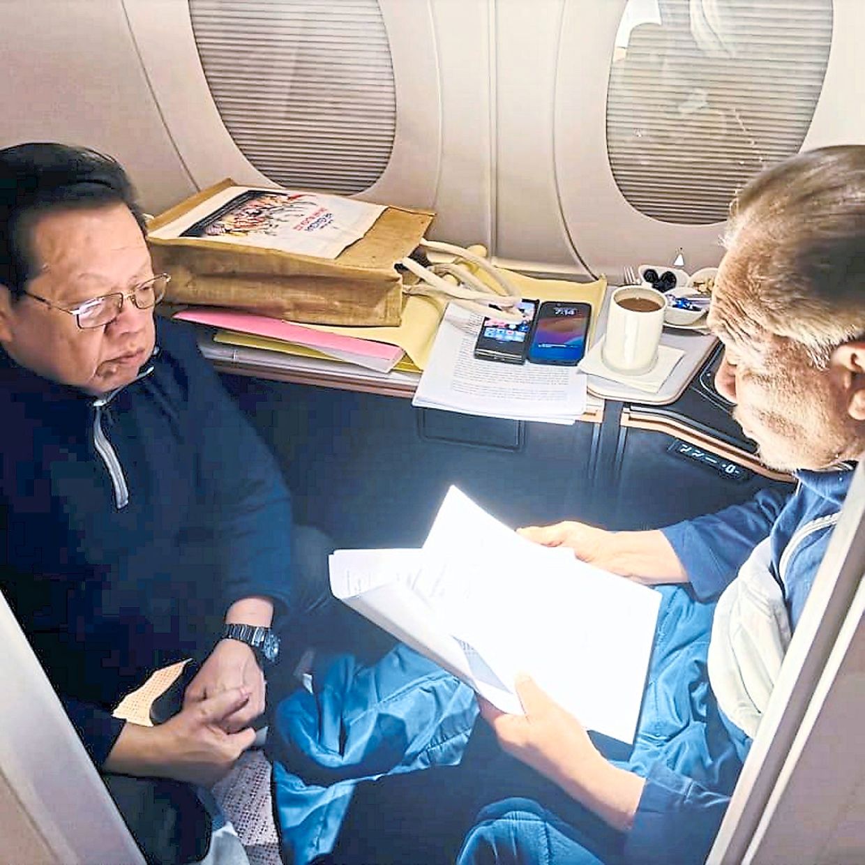 In midair: Anwar in a discussion with Faiz Abdullah.