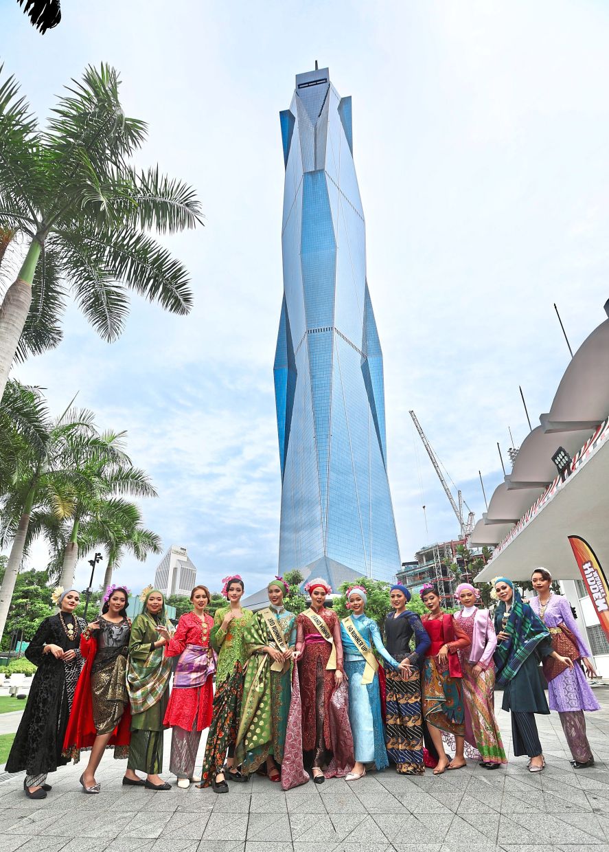The Lenggang Kebaya flashmob members posing in front of the imposing Merdeka 118 tower in Kuala Lumpur. — Photos: LOW BOON TAT/The Star