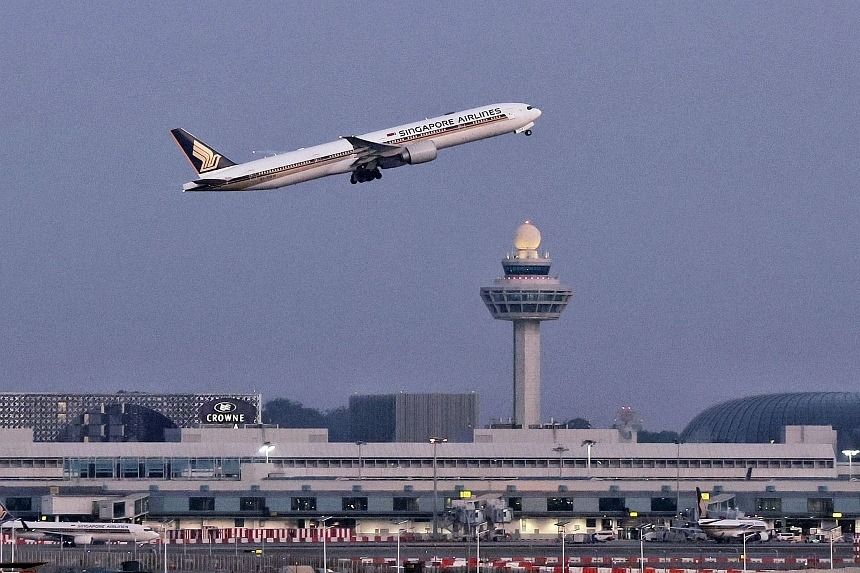 Some 5.22 billion passengers are expected to take to the skies in the coming year, said the International Air Transport Association. -- PHOTO: ST FILE