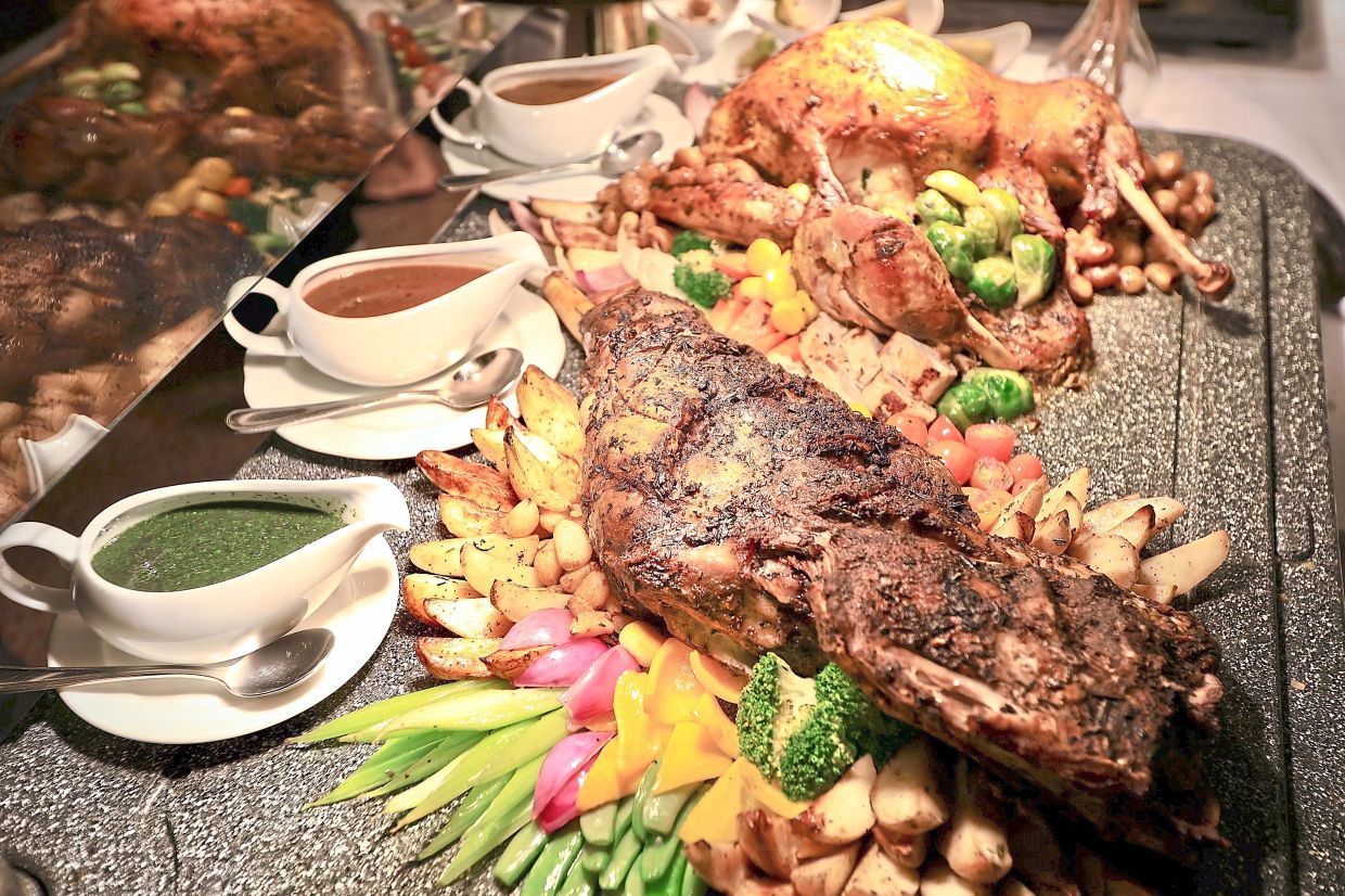 Roast Lamb Leg (foreground) and Christmas Roast Turkey are among succulent carvery highlights at Spice Market Cafe’s Christmas buffets.