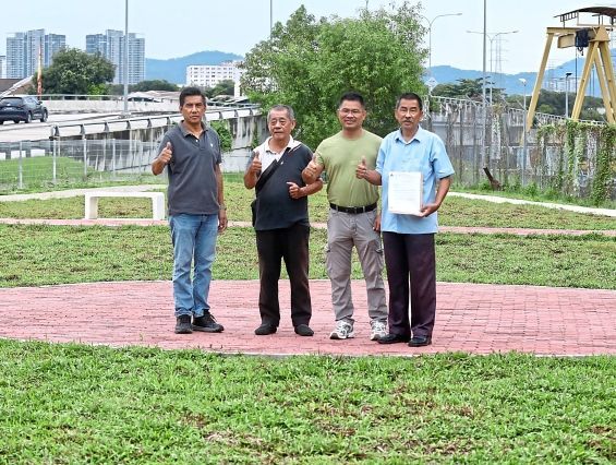 Yee (right) says the pocket park has no lights or trees.