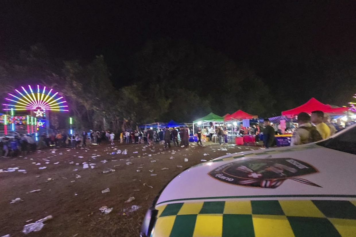 This photo provided by Umphang Rescue shows the site where an explosive device was thrown into a crowd during an annual festival Umphang, Tak province Thailand, Friday, Dec. 13, 2024. - Umphang Rescue via AP