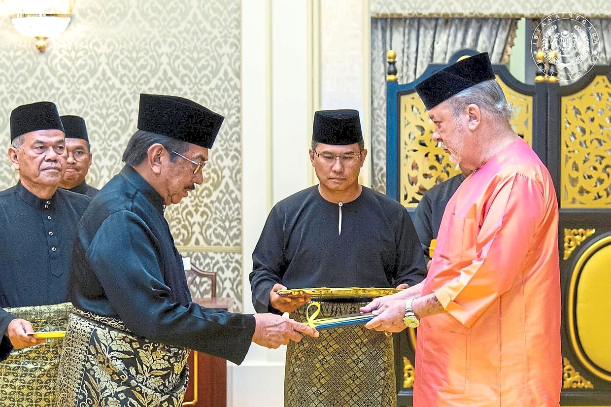 Royal appointment: The King of Malaysia, Sultan Ibrahim, presenting the appointment letter to Musa on Tuesday. — Facebook/ Sultan Ibrahim