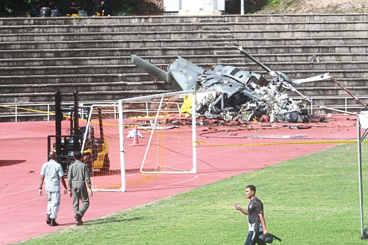 Helicopter debris from the crash that killed 10 at the Lumut Naval Base.