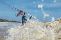Braving the raging waves to catch mullets