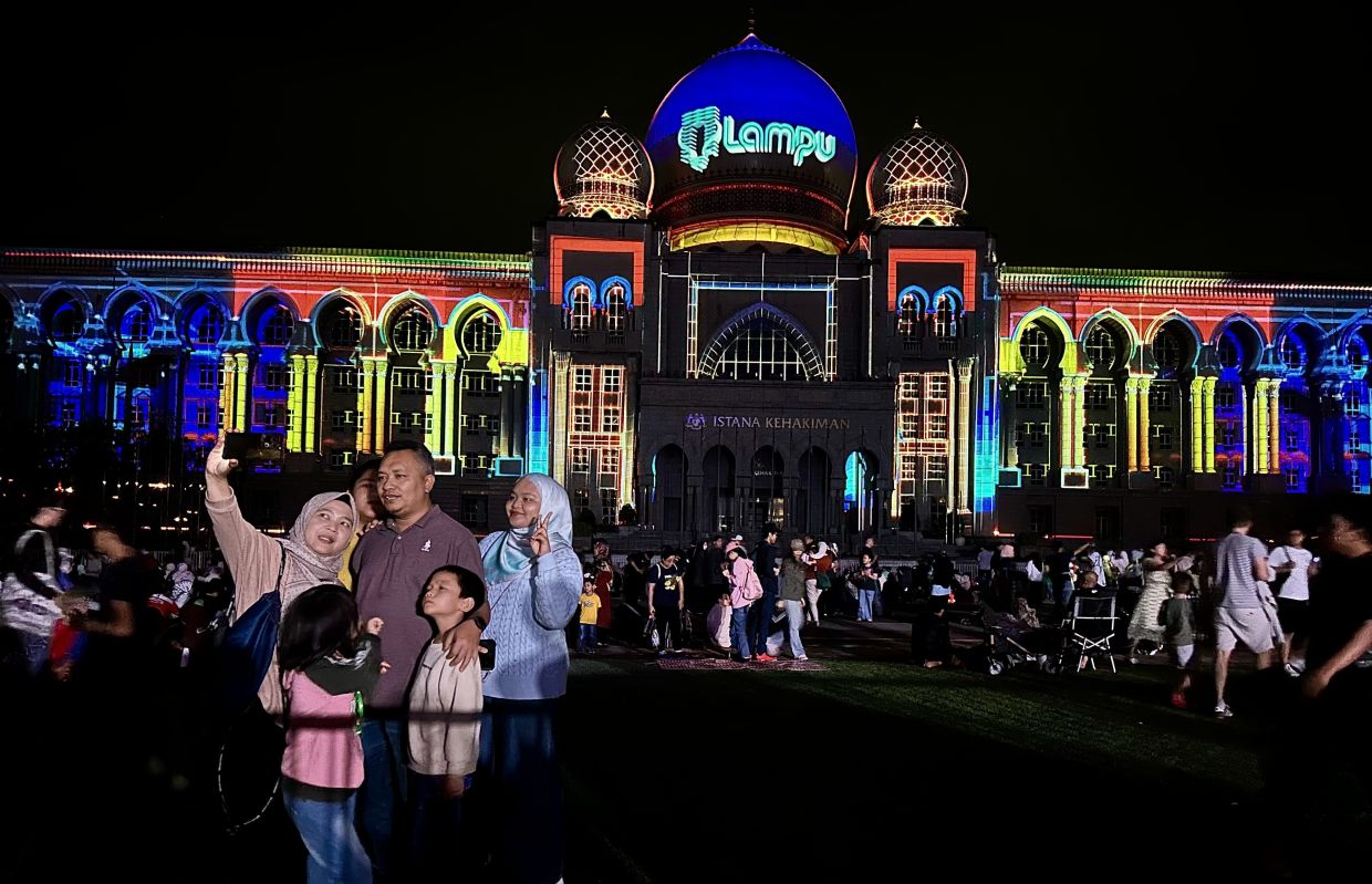 'Lampu 2024' has reconnected with audiences of all ages in Putrajaya, drawing people together through its mesmerising light displays and immersive experiences. Photo: The Star/Shaari Chemat