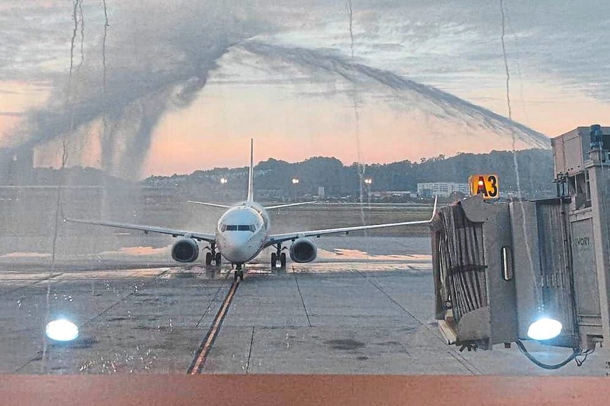 A water salute being given to an aircraft arriving at the Penang International Airport from Pudong, Shanghai.