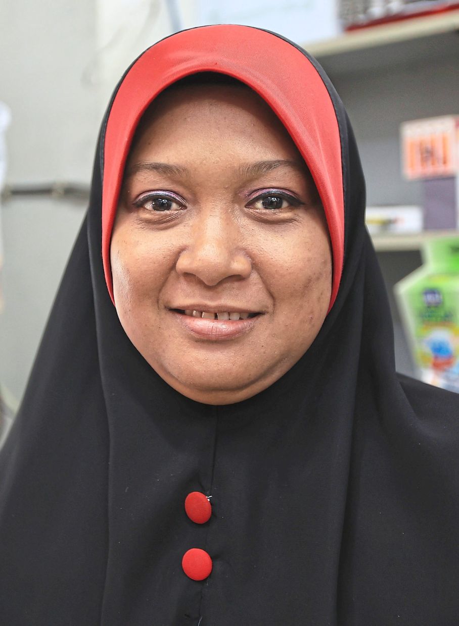 Siti Fatimah feels the financial strain of high living costs.
